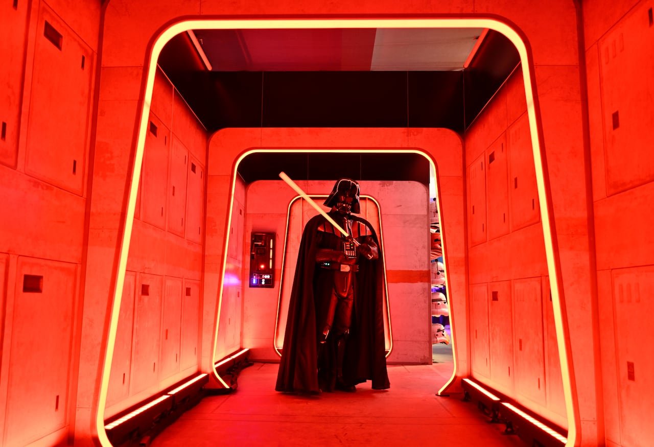default-599 person in star wars darth vader costume stands surrounded by red lights